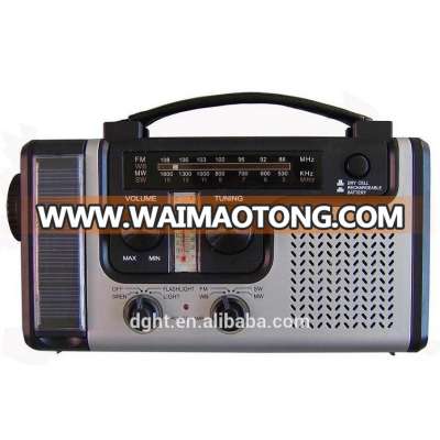 Hand rechargeable with flashlight radio